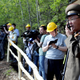 An official from North Korea’s Nuclear Weapons Institute talks on a walkie talkie during the dismantlement process in Punggye-ri.